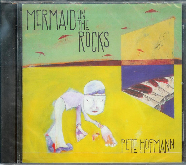 Mermaid On The Rocks