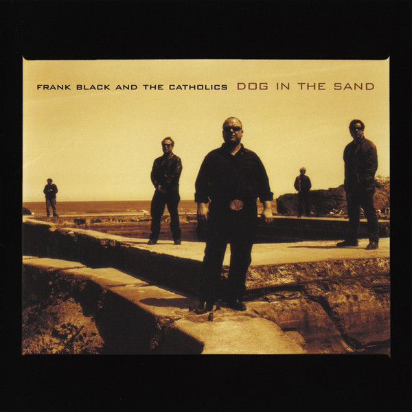 Dog In The Sand