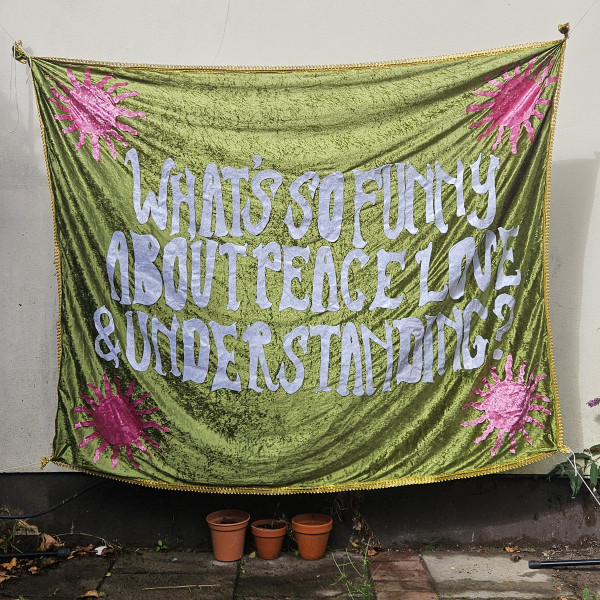 What’s So Funny About Peace Love & Understanding?